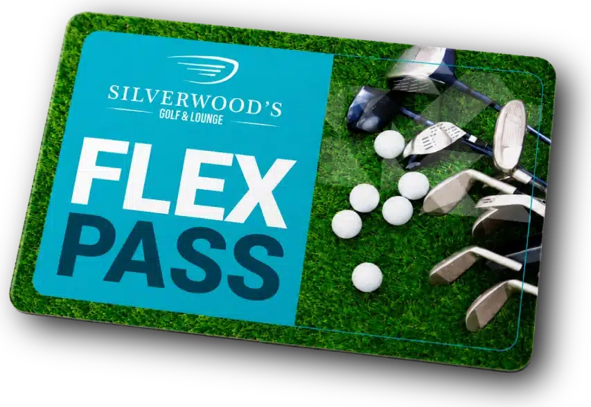 A Silverwoods Golf & Lounge Flex Pass card on green turf, with golf clubs and balls nearby.
