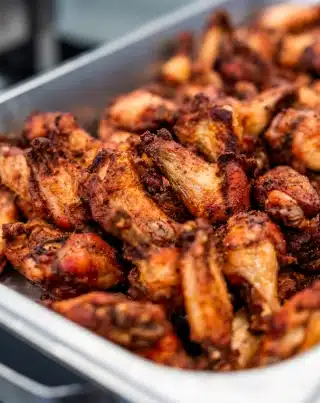 Cooked, seasoned chicken wings arranged on a tray, served fresh at Silverwood’s Golf & Lounge in Kanata.
